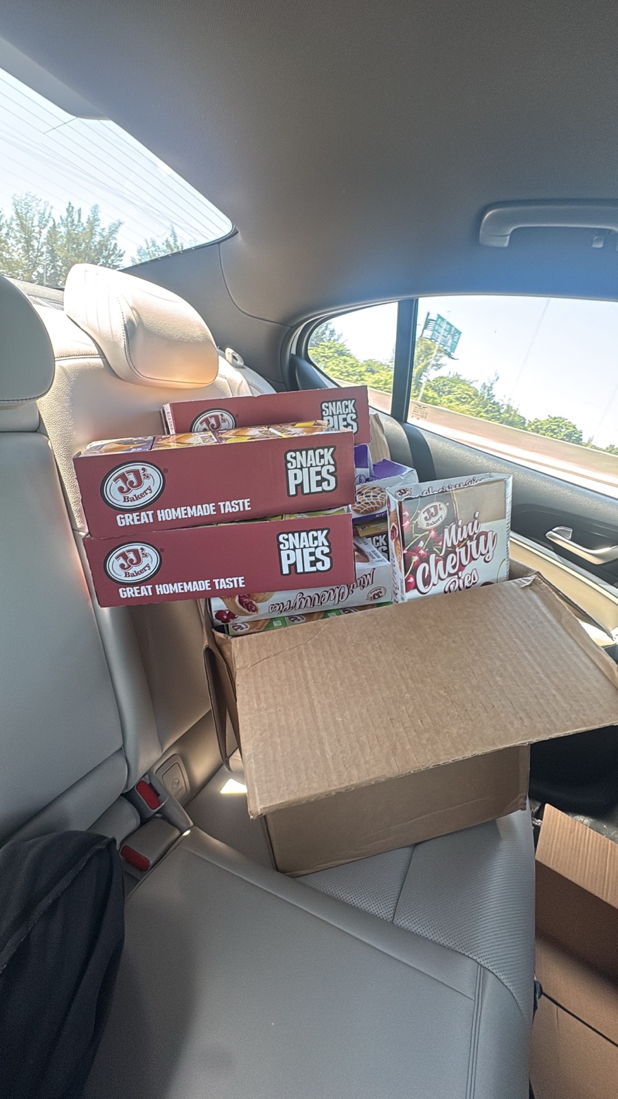 A car loaded with boxes of supplies